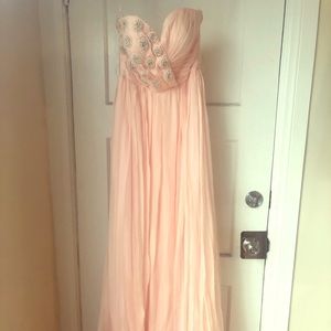 Peach strapless gorgeous gown by Narces